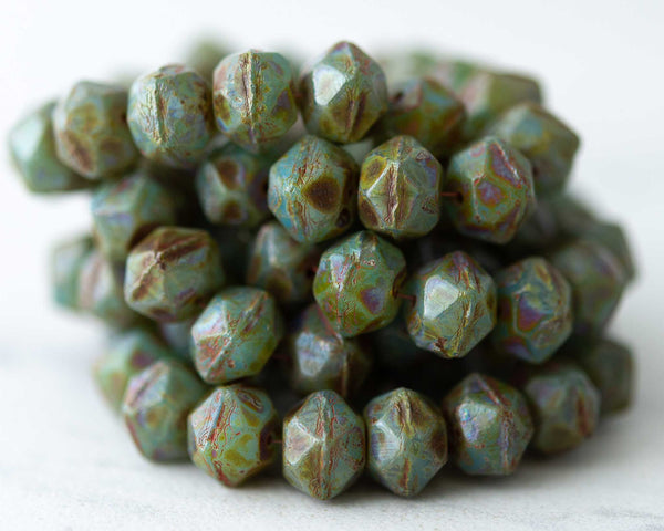 English Cut Czech glass beads for beadwork and crafts. 10mm sized beads in opaque sage green with brown Picasso finish color. 0EVE2280 EV Emporium Co