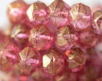 English Cut Czech glass beads for beadwork and crafts. 10mm sized beads in transparent pink with gold luster color. 0EVE2281 EV Emporium Co