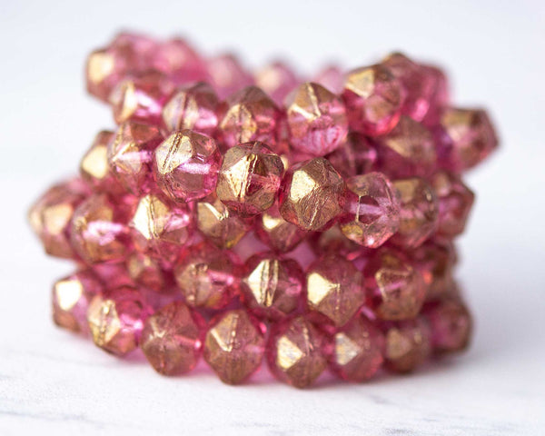 10mm English Cut Czech Glass Beads in pink with gold luster finish. 0EVE22891 Sold by EV Emporium Co