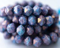 10mm English Cut Czech Glass Beads in powder blue with purple pansy finish. 0EVE1805 Sold by EV Emporium Co