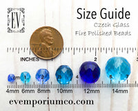 A visual size guide for Czech glass fire polished beads. Beads are shown in sizes 4mm, 6mm, 8mm, 10mm, 12mm and 14mm next to a ruler and a penny for reference. Designed for selecting the correct size for your beading projects and crafts. Provided by bead store EV Emporium Co.