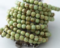 6mm Round Druk Beads Pistachio Green Picasso 0EVE1714